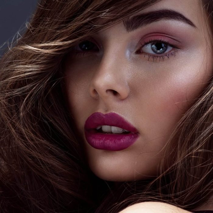 face-of-a-beautiful-woman-with-long-brown-curly-hair-.jpg